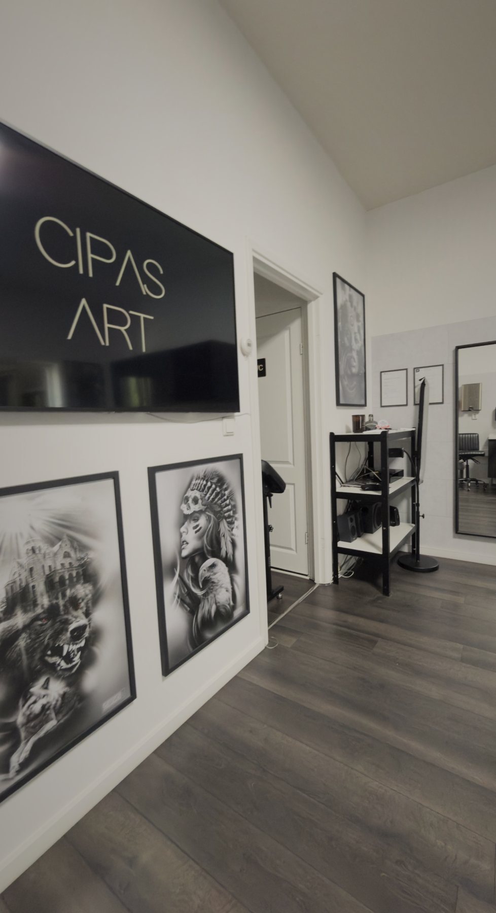 Studio wall with the Cipas Art screen and artwork